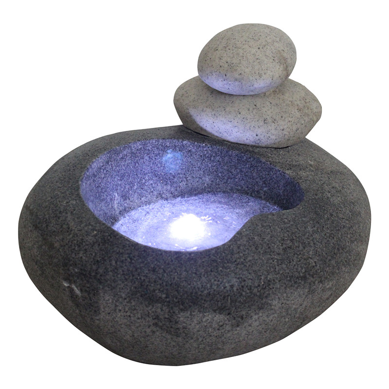 Piedra gemela de jardín interior y al aire libre en una fuente de agua ovalada